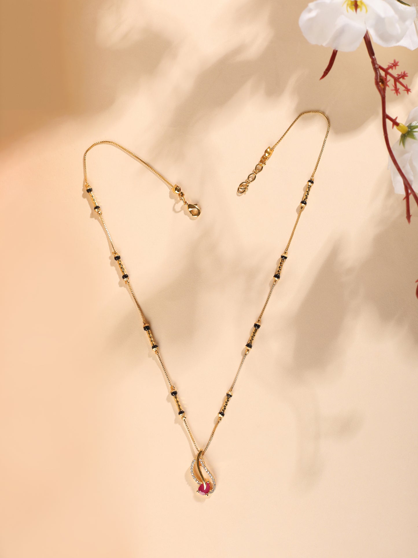 Radiant Teardrop Mangalsutra – Sleek Gold Chain with Pink Accent